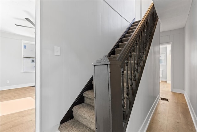 stairway with wood-type flooring