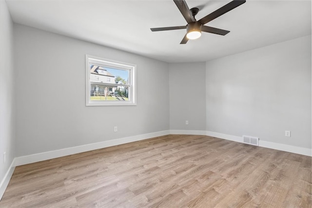 unfurnished room with light hardwood / wood-style flooring and ceiling fan