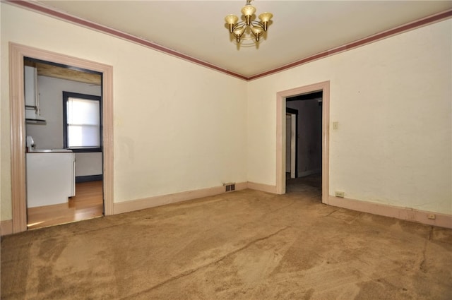 unfurnished room featuring crown molding and carpet flooring