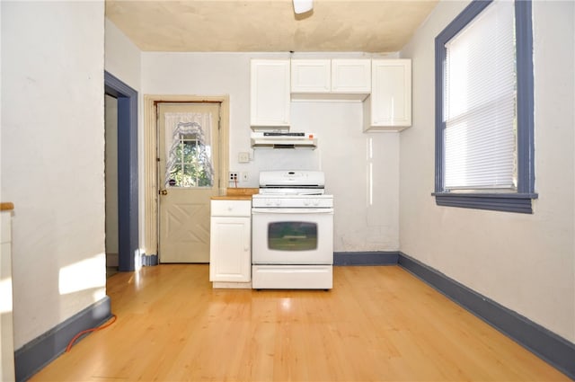 kitchen with ventilation hood, white cabinetry, white stove, and light wood-type flooring