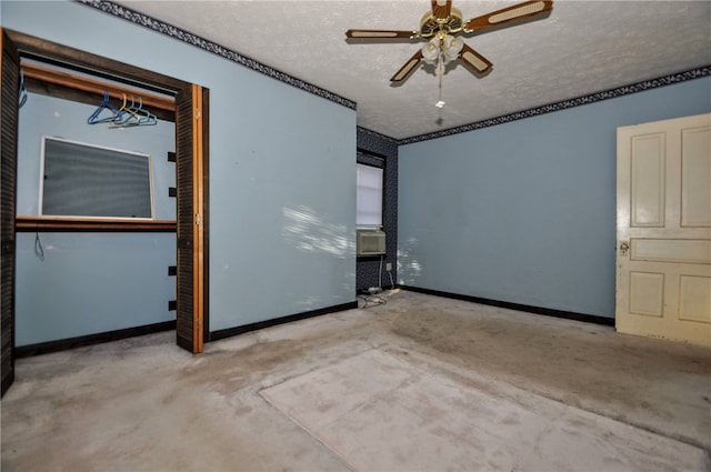 spare room featuring a textured ceiling and ceiling fan