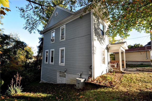 view of side of property with a deck