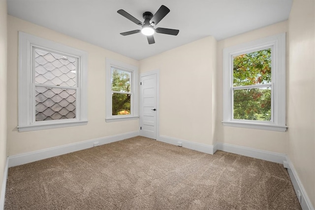 unfurnished room with carpet floors and ceiling fan