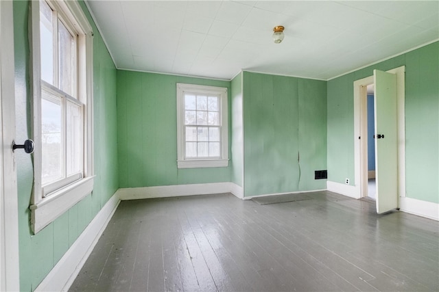 spare room with hardwood / wood-style floors