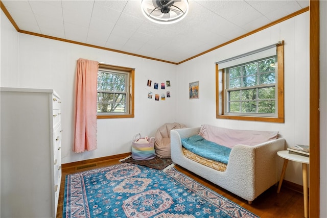 bedroom featuring crown molding and hardwood / wood-style floors