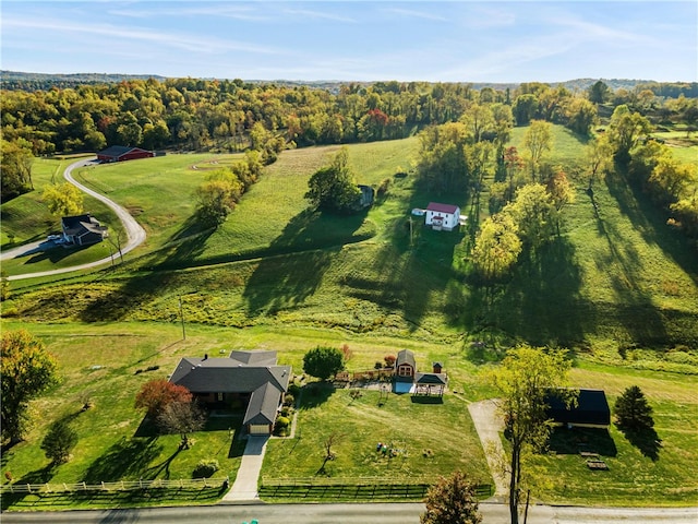 birds eye view of property with a rural view