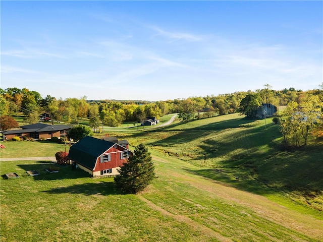 birds eye view of property featuring a rural view