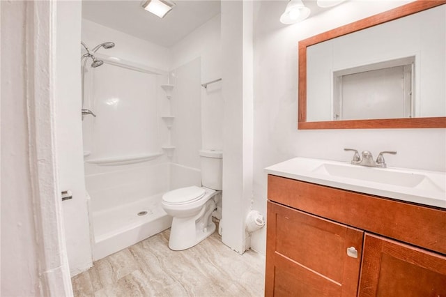 full bath with toilet, walk in shower, and vanity