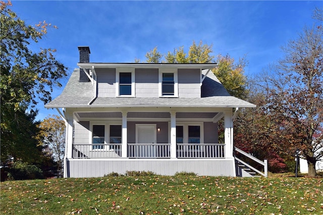 view of front of house featuring a porch and a front lawn