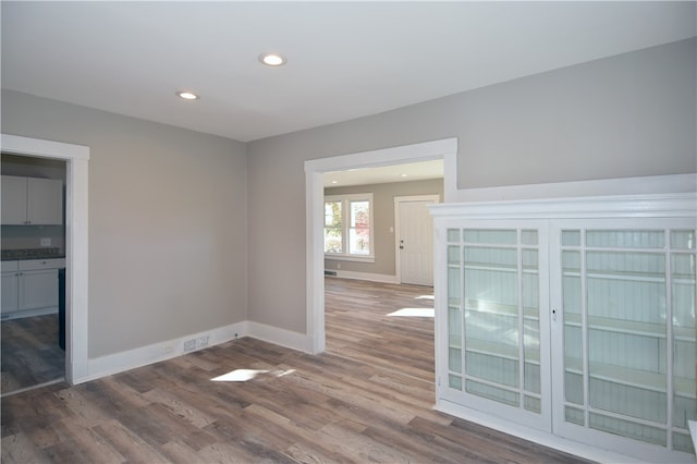 empty room with wood-type flooring