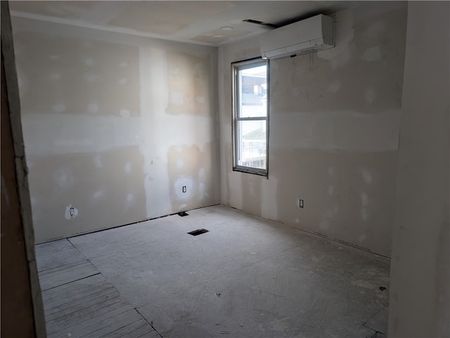 unfurnished room with a wall mounted air conditioner