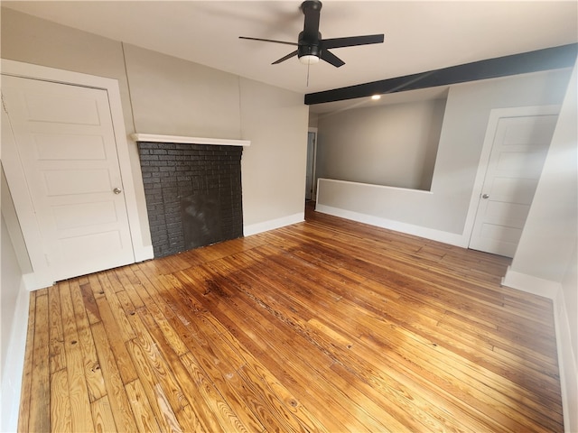 unfurnished bedroom with ceiling fan and hardwood / wood-style floors