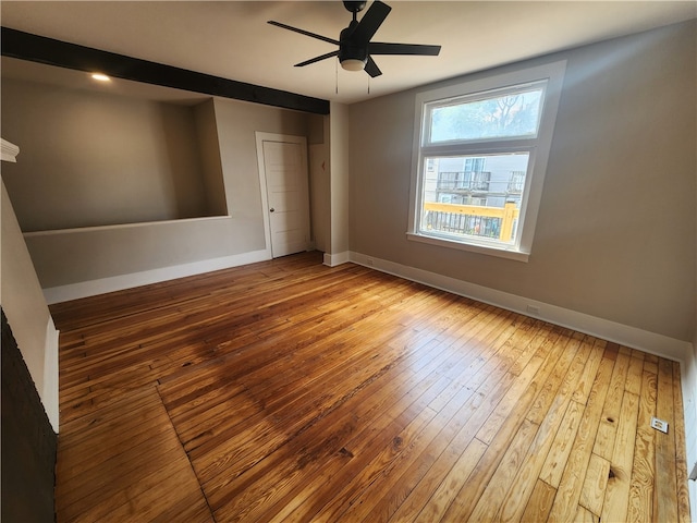 unfurnished room featuring hardwood / wood-style flooring and ceiling fan