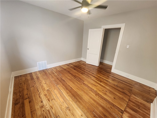 unfurnished bedroom with hardwood / wood-style floors and ceiling fan