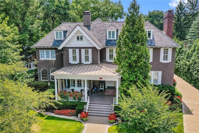 224 Thorn St, Sewickley, PA 15143 - view of front of property with a chimney, a standing seam roof, metal roof, covered porch, and stucco siding