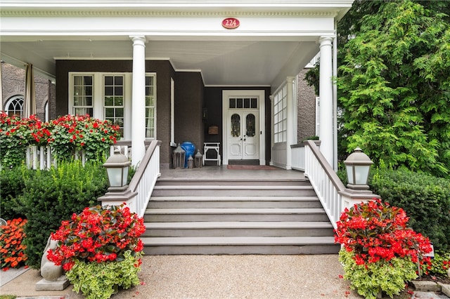 doorway to property featuring covered porch