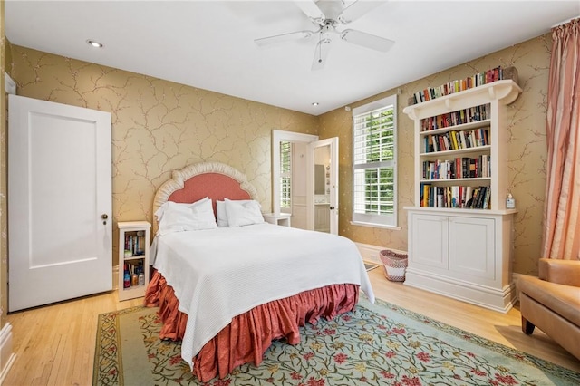 bedroom with wood-type flooring and ceiling fan