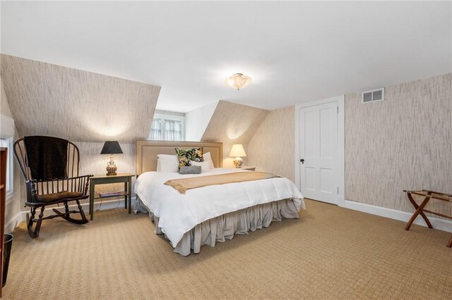 bedroom featuring light carpet