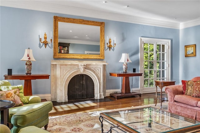 living area featuring dark hardwood / wood-style flooring and crown molding