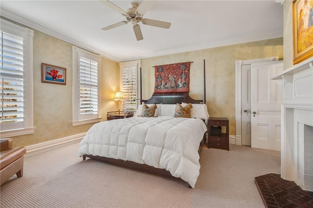 carpeted bedroom featuring ceiling fan, a fireplace, crown molding, and a closet