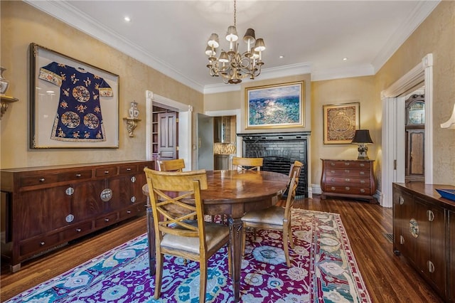 dining space with crown molding, dark hardwood / wood-style flooring, and a chandelier