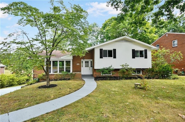 1219 Holy Cross Dr, Monroeville, PA 15146 - tri-level home with brick siding and a front yard