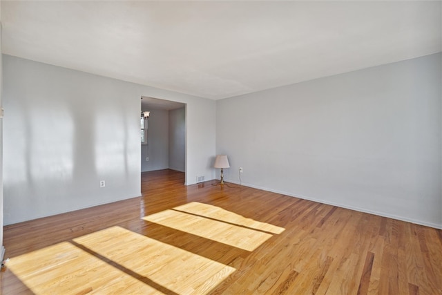 unfurnished room featuring wood-type flooring