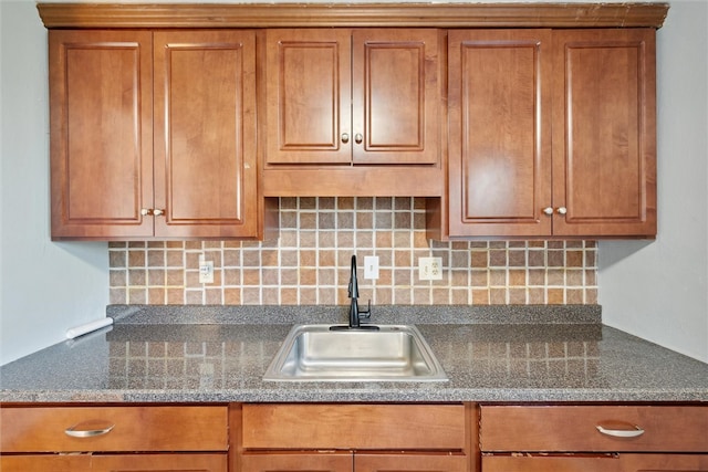 kitchen featuring sink and decorative backsplash