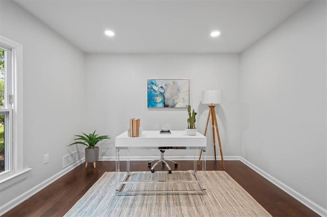 home office with dark wood-type flooring