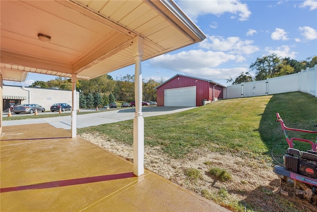 view of yard featuring an outbuilding and a garage