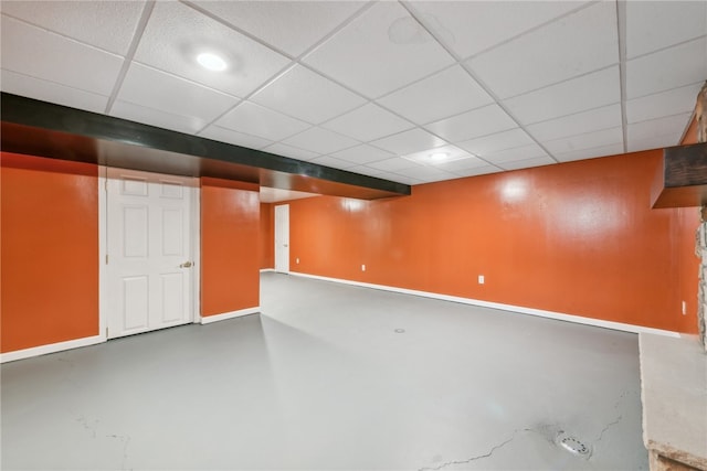 basement featuring a paneled ceiling