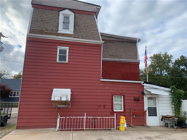 back of property with a patio