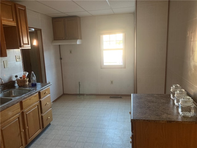 kitchen with sink and a drop ceiling