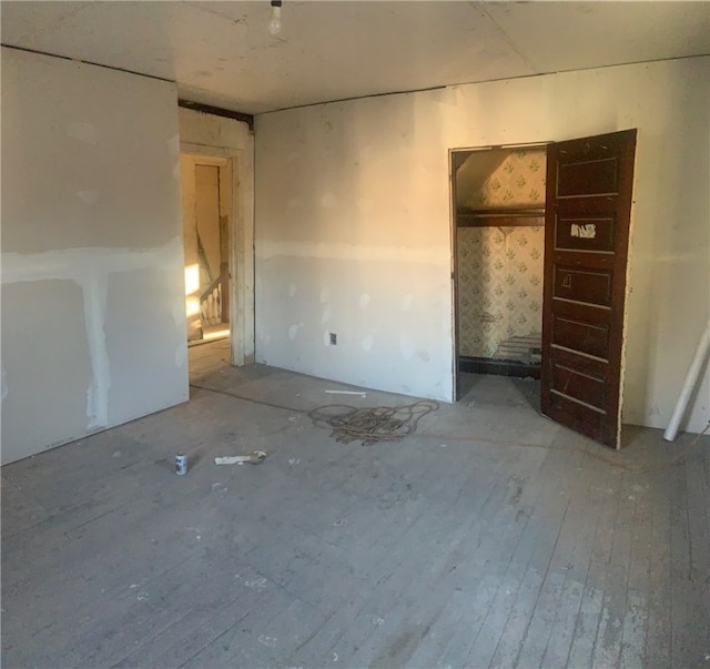 unfurnished bedroom featuring hardwood / wood-style floors