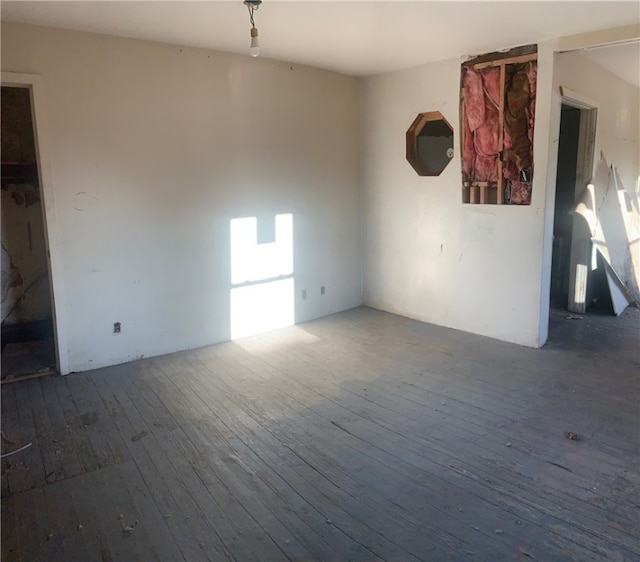 unfurnished room featuring hardwood / wood-style floors