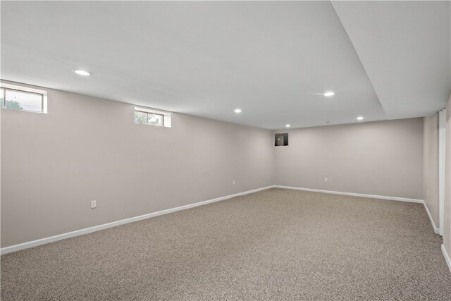 basement featuring a healthy amount of sunlight and carpet