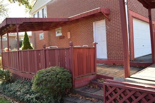 view of side of home featuring a garage and a deck