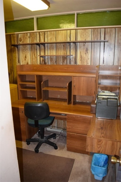 carpeted office with built in desk