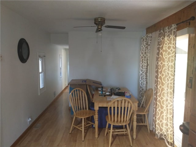 dining space featuring light hardwood / wood-style floors and ceiling fan