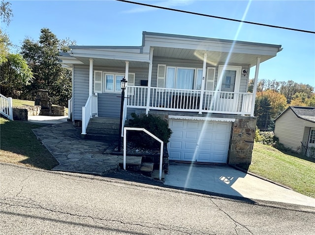 view of front facade featuring covered porch and a garage