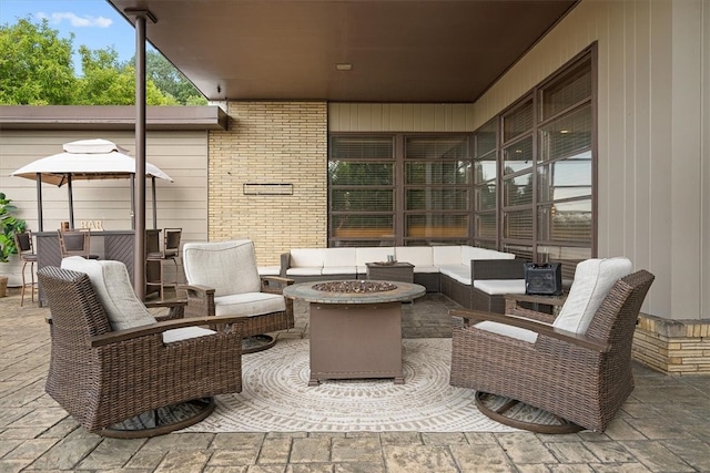 view of patio / terrace featuring an outdoor living space with a fire pit