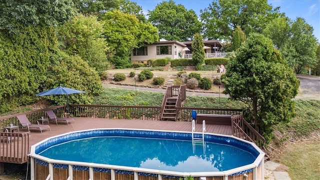 view of pool featuring a wooden deck