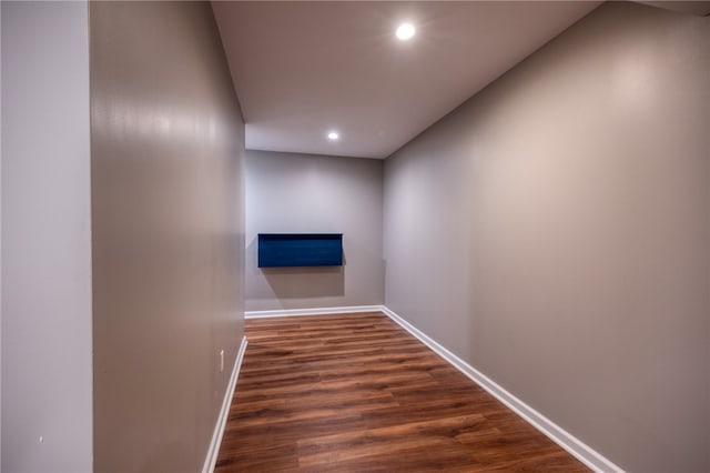 corridor with dark wood-type flooring