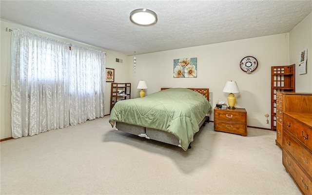 carpeted bedroom with a textured ceiling