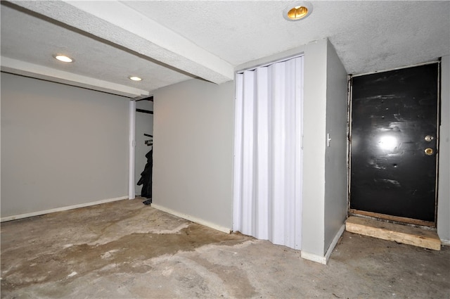 basement with a textured ceiling