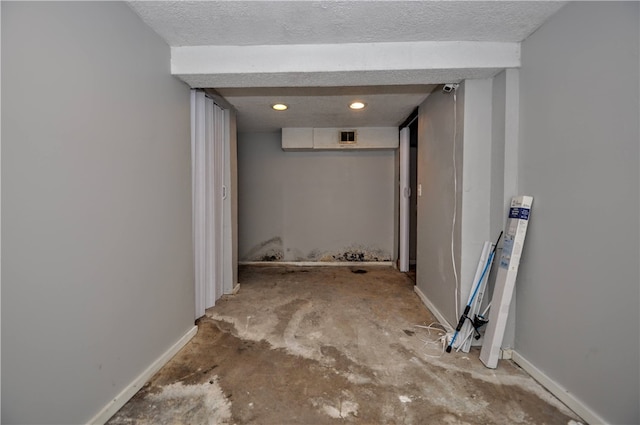 basement with a textured ceiling