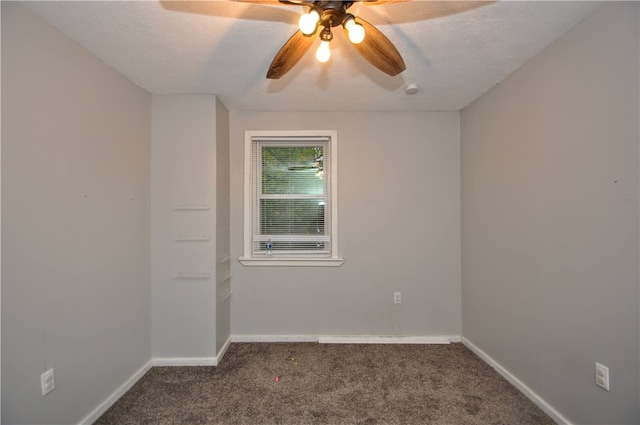 carpeted spare room with ceiling fan and a textured ceiling