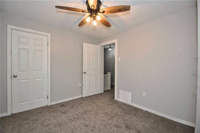 unfurnished bedroom with carpet floors and ceiling fan