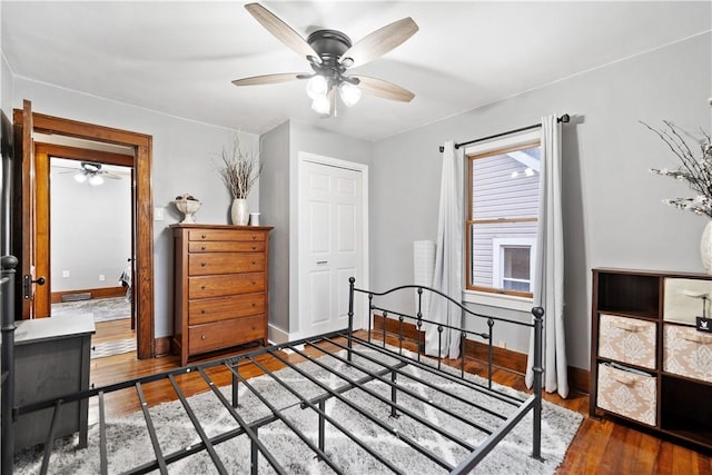 bedroom featuring hardwood / wood-style flooring and ceiling fan