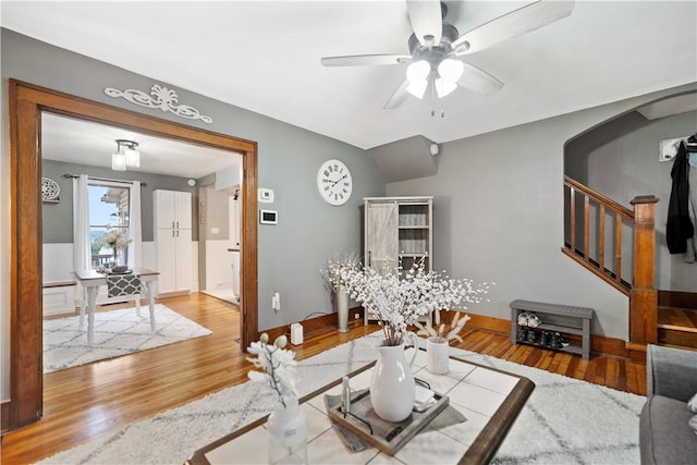 living room featuring hardwood / wood-style flooring and ceiling fan